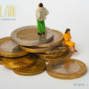 Law firm logo in top left with miniature figures on a stack of coins, conveying financial/legal services; site text reads www.jz wlaw.ca