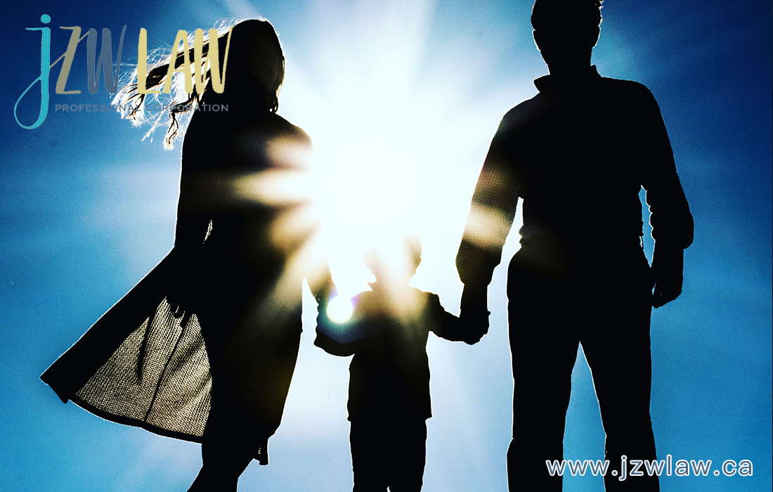 Silhouetted family of three holding hands against a bright sun and blue sky; logo in the top-left corner suggesting a family-focused law firm.